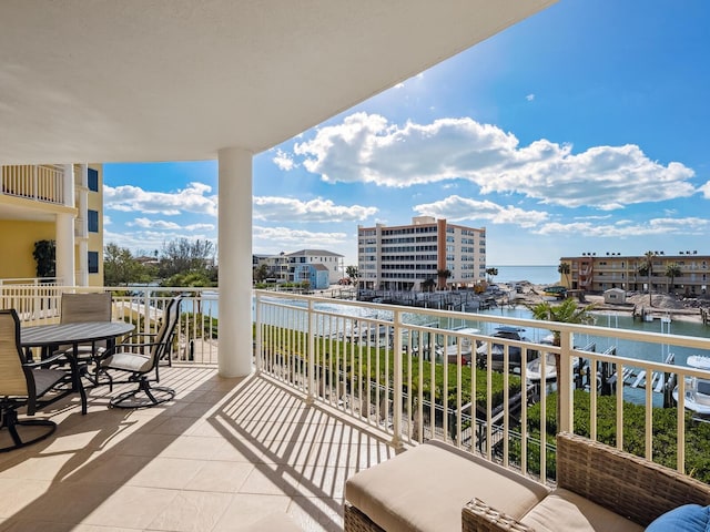 balcony featuring a water view