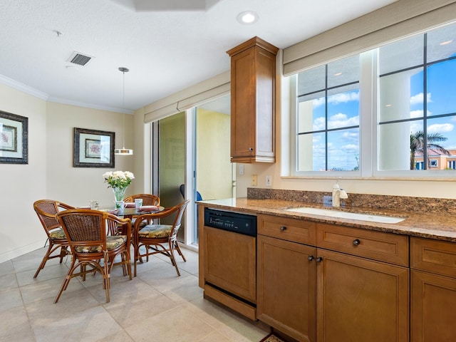 kitchen with dishwasher, sink, crown molding, dark stone counters, and pendant lighting