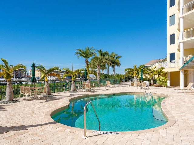 view of swimming pool featuring a patio