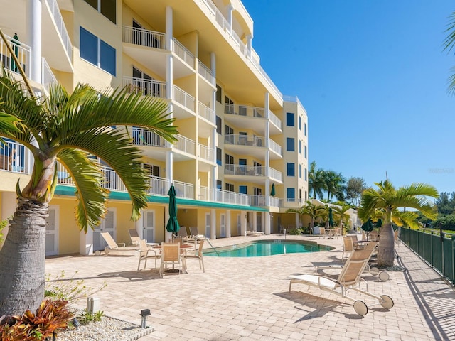 view of swimming pool with a patio