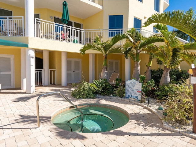 exterior space featuring a community hot tub