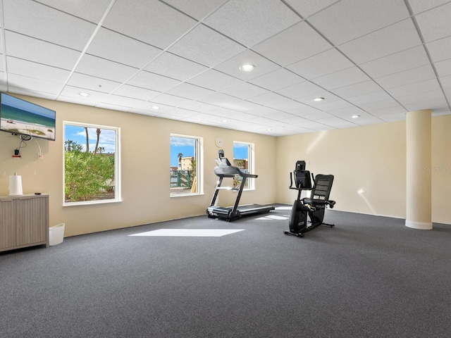 workout room with carpet flooring, radiator heating unit, and a drop ceiling