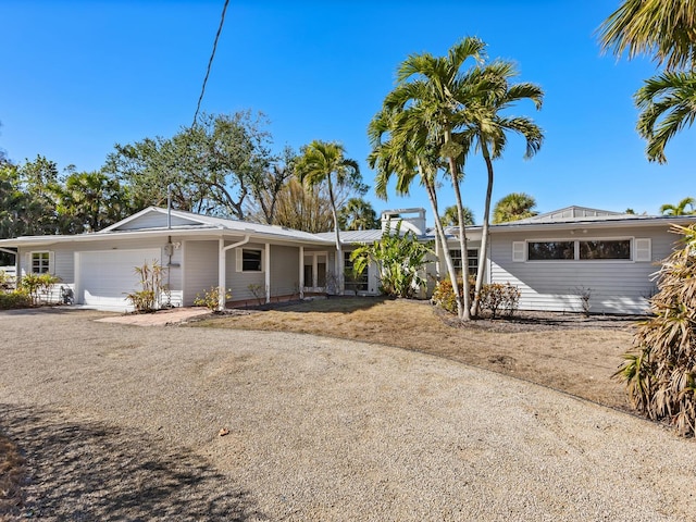 single story home featuring a garage