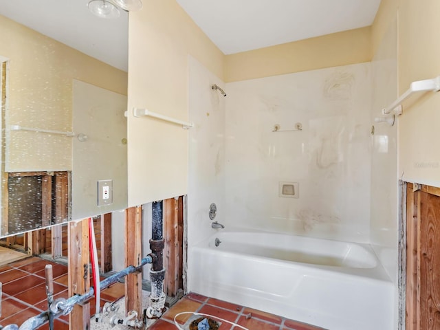 bathroom featuring tile patterned flooring and shower / bath combination