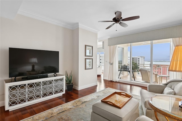 living room with ceiling fan, dark hardwood / wood-style flooring, and crown molding