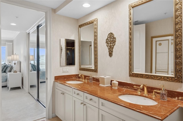 bathroom featuring vanity and crown molding