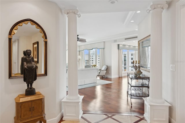 interior space with wood-type flooring and decorative columns