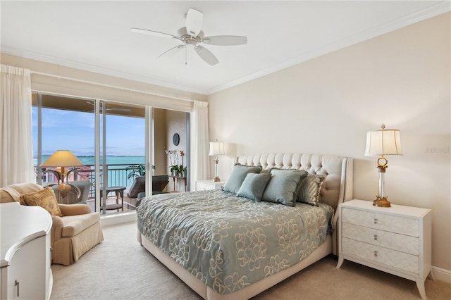 carpeted bedroom with access to outside, ceiling fan, crown molding, and a water view