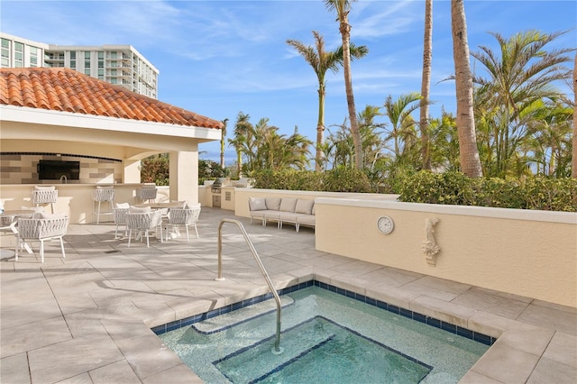 view of swimming pool with a patio area and a community hot tub