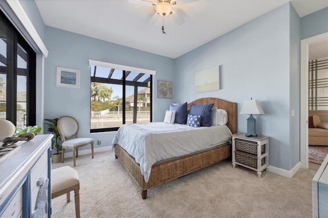 bedroom featuring ceiling fan and light colored carpet