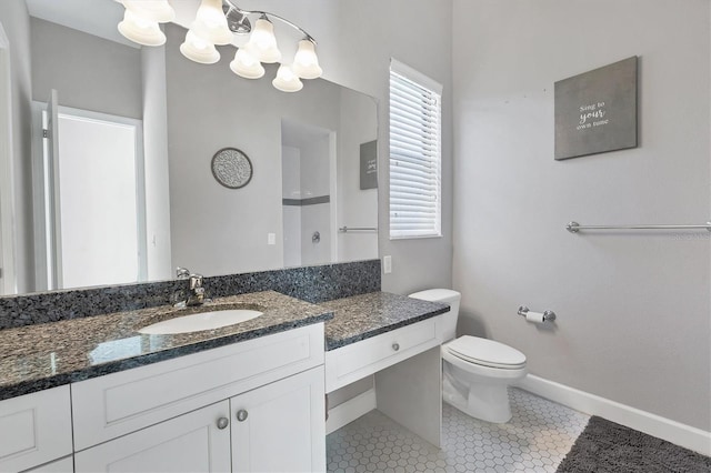 bathroom featuring tile patterned floors, vanity, toilet, and walk in shower