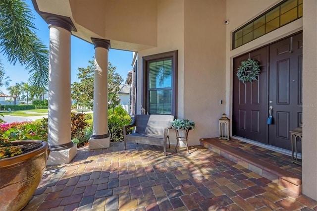 entrance to property featuring a porch