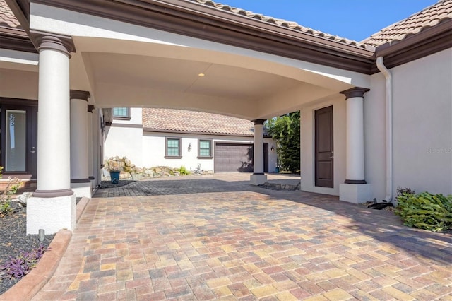 view of patio featuring a garage