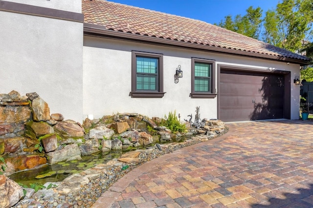 view of side of home with a garage