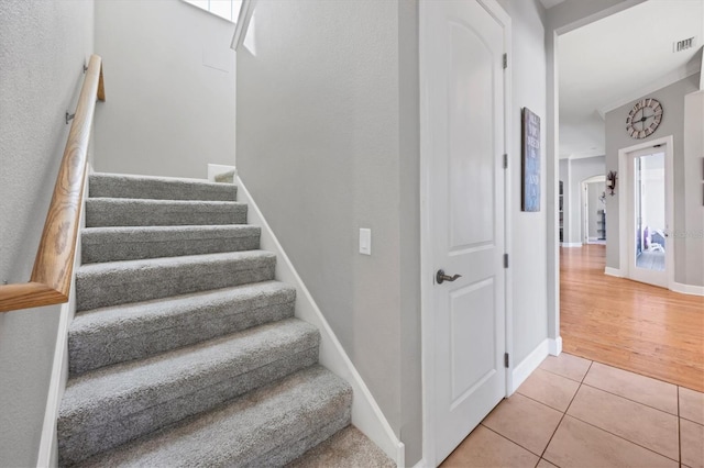 stairway with hardwood / wood-style flooring