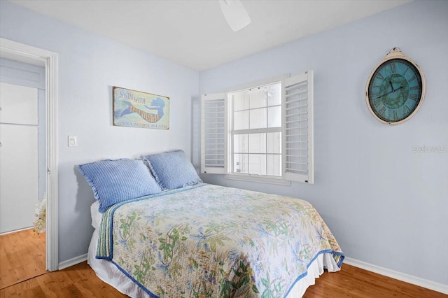 bedroom featuring ceiling fan and hardwood / wood-style flooring