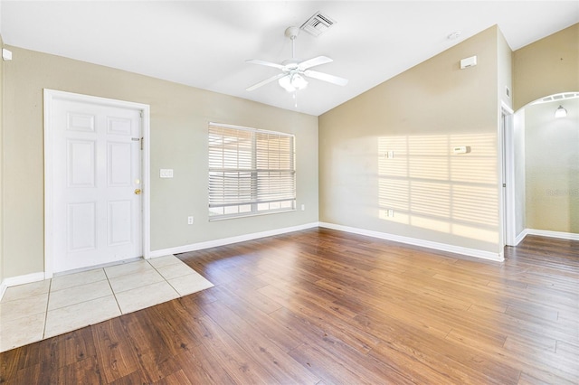 foyer featuring vaulted ceiling, light hardwood / wood-style flooring, and ceiling fan