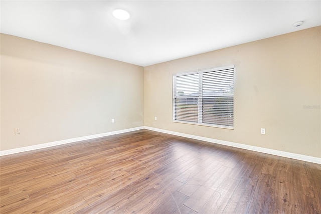 empty room featuring wood-type flooring