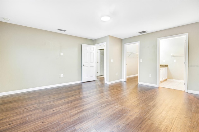 spare room with hardwood / wood-style floors