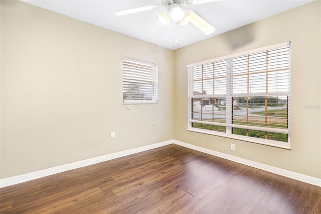 empty room with ceiling fan and hardwood / wood-style flooring