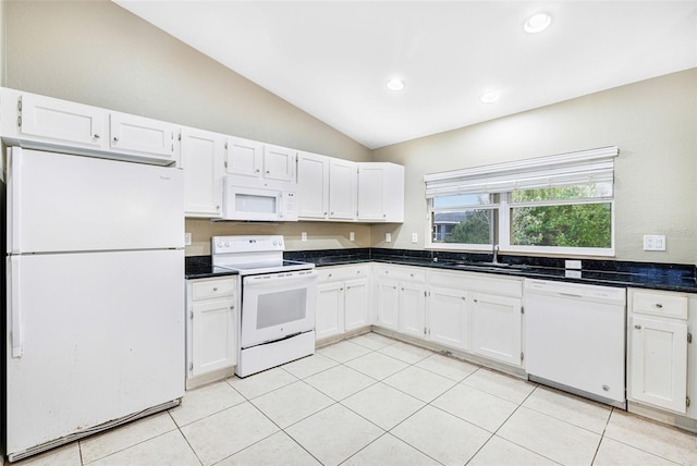 kitchen with lofted ceiling, white cabinetry, and white appliances