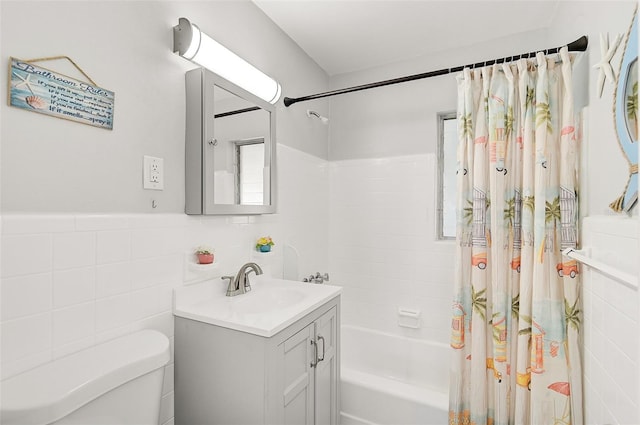 full bathroom featuring tile walls, toilet, vanity, and shower / bathtub combination with curtain