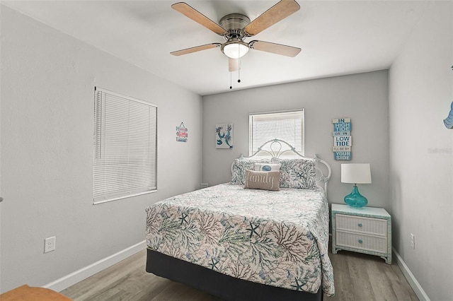 bedroom featuring ceiling fan and wood-type flooring