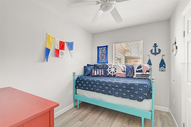 bedroom with light wood-type flooring and ceiling fan