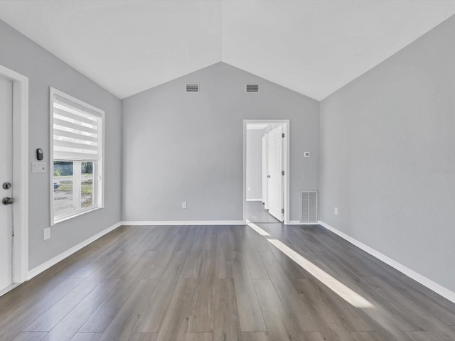 interior space featuring wood-type flooring and vaulted ceiling