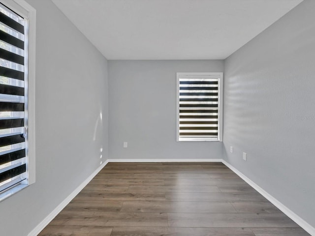 empty room featuring dark hardwood / wood-style floors