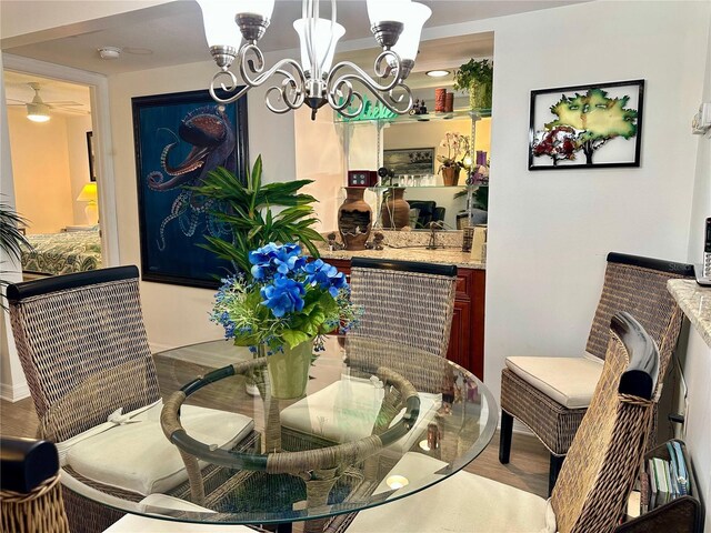 4445 46th Ave W, Bradenton, FL 34210 - dining room featuring a chandelier and wood finished floors