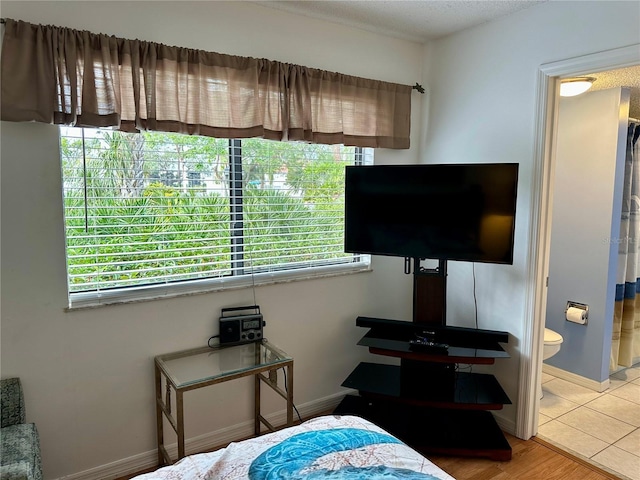 4445 46th Ave W, Bradenton, FL 34210 - bedroom featuring ensuite bath and baseboards
