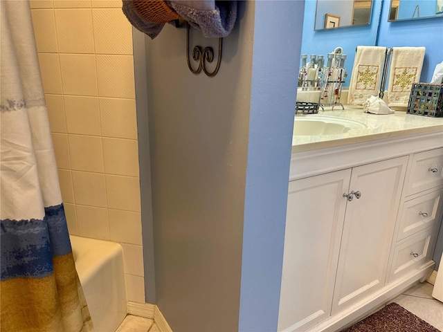 bathroom with tile patterned flooring, vanity, and shower / bath combo