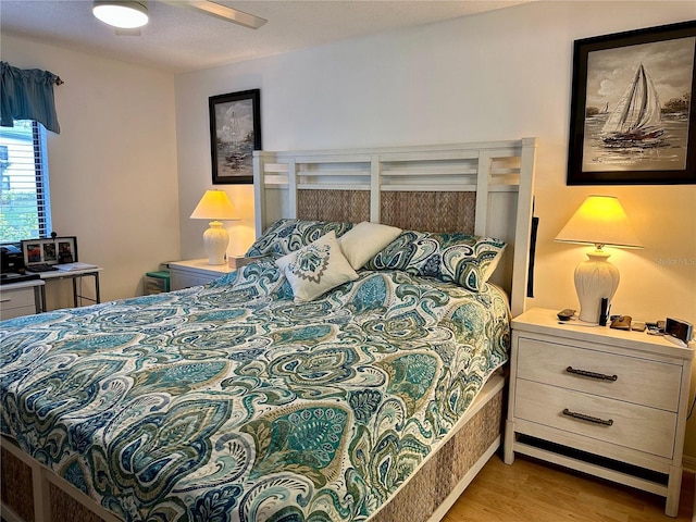 bedroom featuring ceiling fan and light hardwood / wood-style floors