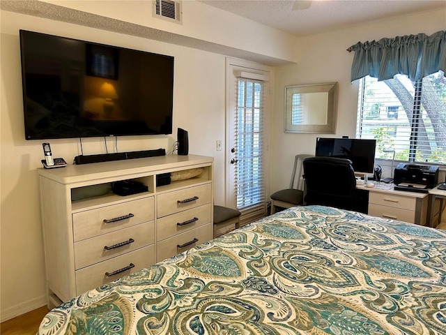 bedroom featuring ceiling fan and hardwood / wood-style flooring