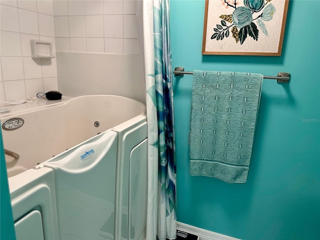 bathroom featuring washer / clothes dryer