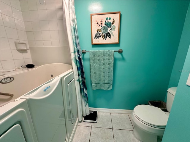 bathroom with tile patterned floors, independent washer and dryer, independent shower and bath, and toilet