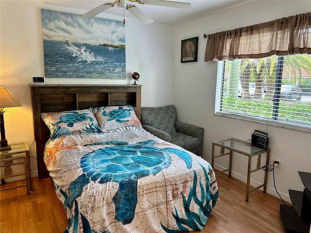 bedroom featuring hardwood / wood-style floors and ceiling fan