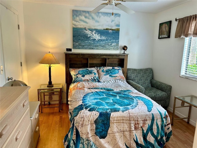 bedroom featuring ceiling fan and wood-type flooring