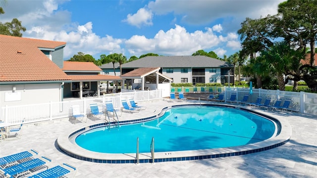 view of swimming pool featuring a patio area