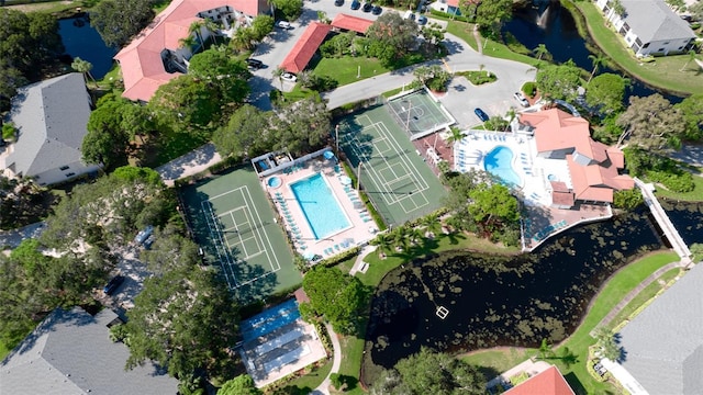 birds eye view of property with a water view