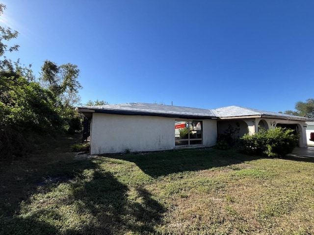 view of home's exterior with a yard