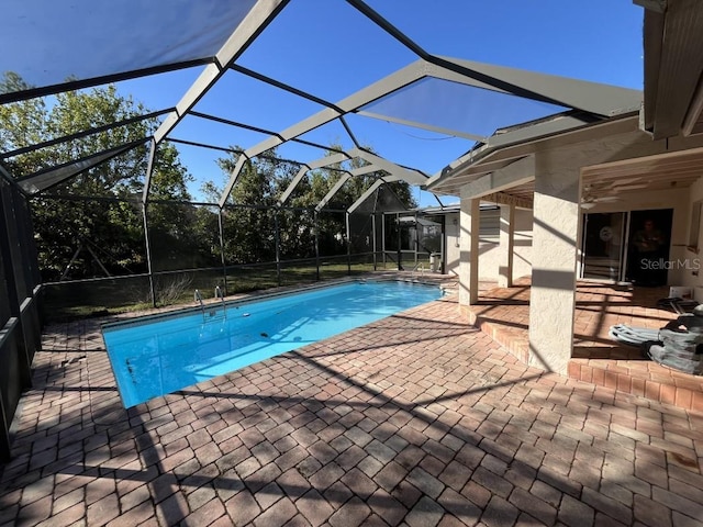 view of pool featuring a patio area and a lanai