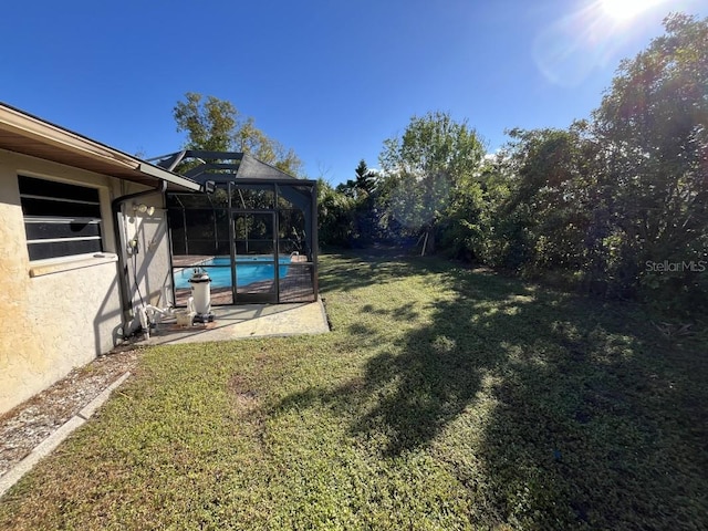 view of yard with a lanai