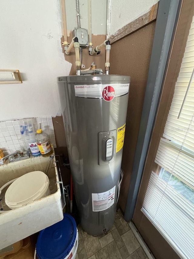 utility room with electric water heater