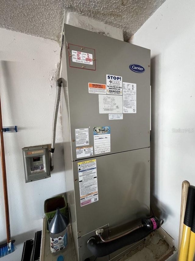 utility room with heating unit