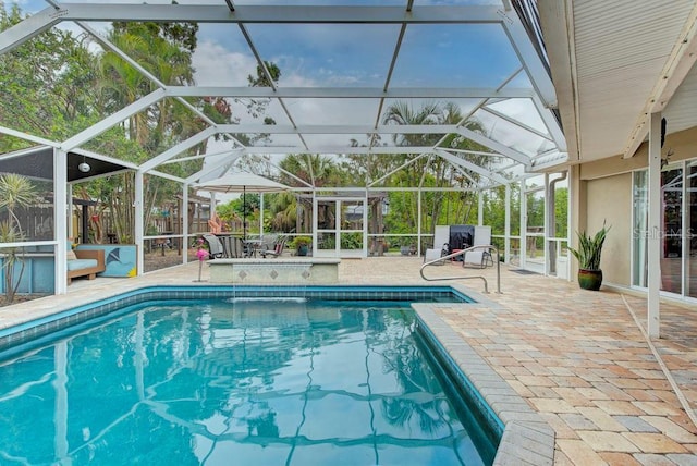 view of pool featuring a lanai and a patio area