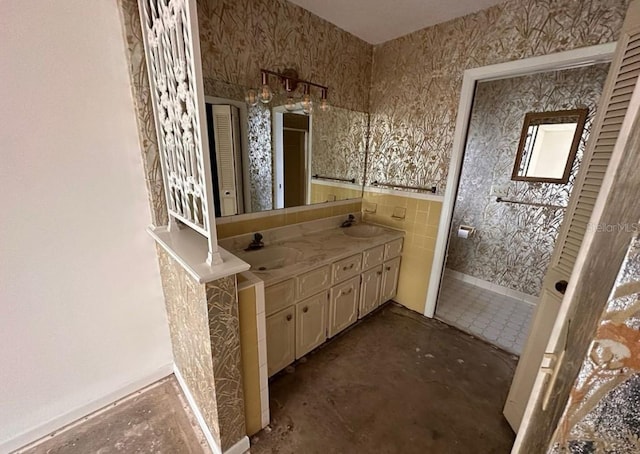 bathroom with vanity and concrete flooring