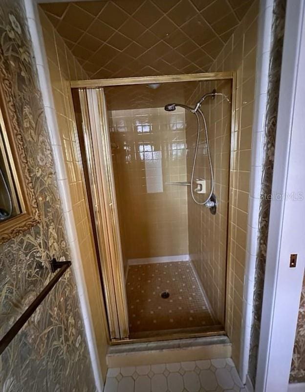 bathroom with tiled shower