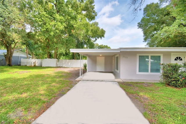 entrance to property with a yard